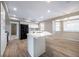 Updated kitchen with stainless steel appliances, white cabinets and quartz countertops at 904 Hibiscus Ct, Henderson, NV 89011