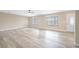 Spacious living room featuring hard surface floors, neutral walls, and bright windows at 904 Hibiscus Ct, Henderson, NV 89011