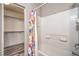 Bright bathroom with white tiled shower and closet at 9117 Careful Canvas Ave, Las Vegas, NV 89149