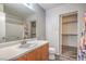 A clean bathroom features a vanity with a sink, toilet, shower, and a walk in closet at 9117 Careful Canvas Ave, Las Vegas, NV 89149