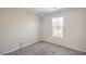 Cozy bedroom with soft carpet, natural light from the window, and LED lighting at 9117 Careful Canvas Ave, Las Vegas, NV 89149