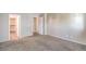An empty bedroom features neutral colored walls and carpet with a closet in view at 9117 Careful Canvas Ave, Las Vegas, NV 89149