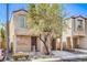 Charming two-story home with inviting front porch and well-kept landscaping at 9117 Careful Canvas Ave, Las Vegas, NV 89149