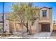 Attractive two-story home with an attached garage and neatly manicured front yard at 9117 Careful Canvas Ave, Las Vegas, NV 89149