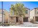 Charming two-story home featuring a cozy front porch and attached garage, showcasing a well-maintained facade at 9117 Careful Canvas Ave, Las Vegas, NV 89149