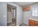 A convenient laundry room is showcased with wood cabinets, counter space, and decorative window at 9117 Careful Canvas Ave, Las Vegas, NV 89149