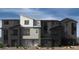 Contemporary townhome showcasing modern architecture and clean lines, perfect for urban living at 9237 Soho Sky Ct, Las Vegas, NV 89148