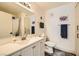Bright bathroom featuring a wide mirror, neutral-toned walls, and drawers at 950 Seven Hills Dr # 814, Henderson, NV 89052