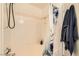 Bathroom tub with tiled walls and showerhead, and includes a shower curtain at 950 Seven Hills Dr # 814, Henderson, NV 89052