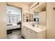 The bathroom features an expansive mirror, modern drawers and a sink, and stylish flooring at 950 Seven Hills Dr # 814, Henderson, NV 89052