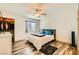 Neutral bedroom showcasing a ceiling fan, closet, window and stylish flooring at 950 Seven Hills Dr # 814, Henderson, NV 89052