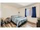 Cozy bedroom with natural light, laminate floors, and comfortable bedding at 950 Seven Hills Dr # 814, Henderson, NV 89052