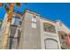 Exterior view of building with address numbers and balcony with stairs at 950 Seven Hills Dr # 814, Henderson, NV 89052