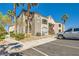 Attractive two-story condo building with balconies, stairs and desert landscaping at 950 Seven Hills Dr # 814, Henderson, NV 89052