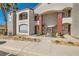 Attractive two-story condo building with balconies, stairs and desert landscaping at 950 Seven Hills Dr # 814, Henderson, NV 89052