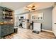 Spacious kitchen featuring stainless appliances, white cabinets, and updated flooring at 950 Seven Hills Dr # 814, Henderson, NV 89052