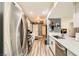 Spacious kitchen featuring stainless steel appliances, white countertops, and wood-look floors at 950 Seven Hills Dr # 814, Henderson, NV 89052