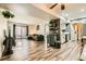 Open living room with hardwood-style floors, a modern sofa, and a sliding glass door to the outside at 950 Seven Hills Dr # 814, Henderson, NV 89052