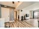 An open living room features hardwood floors, a door to the exterior, and a view of the bedroom at 950 Seven Hills Dr # 814, Henderson, NV 89052
