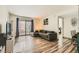 Cozy living room with wood floors, a sofa, and natural light at 950 Seven Hills Dr # 814, Henderson, NV 89052