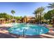 Beautiful community pool with lounge chairs and palm trees on a sunny day at 950 Seven Hills Dr # 814, Henderson, NV 89052
