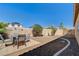 A fenced yard with desert landscaping provides a secure area for outdoor relaxation and entertaining at 97 Zimmerman St, Henderson, NV 89002