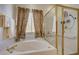 Corner bathroom with tub and separate shower stall at 97 Zimmerman St, Henderson, NV 89002