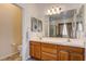 Bathroom vanity with double sinks and wood cabinets at 97 Zimmerman St, Henderson, NV 89002