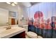 Full bathroom with desert motif shower curtain, and vanity at 97 Zimmerman St, Henderson, NV 89002