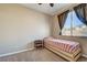 Bright bedroom with neutral walls, carpet, and natural light at 97 Zimmerman St, Henderson, NV 89002