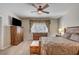 Bedroom featuring wooden furniture, a ceiling fan, and neutral decor at 97 Zimmerman St, Henderson, NV 89002