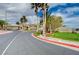 Palm Hills entrance with paved road, sidewalk and sign at 97 Zimmerman St, Henderson, NV 89002