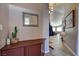 Entryway with mirror, side table, and hallway visible to living area at 97 Zimmerman St, Henderson, NV 89002