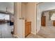 Hallway featuring a built-in cabinet and leads to both the living room and bedroom at 97 Zimmerman St, Henderson, NV 89002