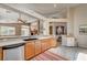 Bright kitchen featuring wood cabinets and view of the living space at 97 Zimmerman St, Henderson, NV 89002