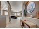 Open living room boasts tile flooring, ceiling fans, and plenty of natural light at 97 Zimmerman St, Henderson, NV 89002