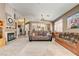 A spacious living room features a fireplace, ceiling fan and an open floor plan at 97 Zimmerman St, Henderson, NV 89002