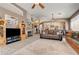 A spacious living room features a fireplace, ceiling fan and an open floor plan at 97 Zimmerman St, Henderson, NV 89002