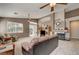 A spacious living room features a fireplace, ceiling fan and a sliding glass door at 97 Zimmerman St, Henderson, NV 89002