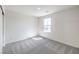 Carpeted bedroom with natural light coming through the window at 1027 Gentle Swan St # 689, Henderson, NV 89011