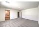 Large bedroom featuring neutral carpet, white walls, and an ensuite bathroom providing a relaxing retreat at 1027 Gentle Swan St # 689, Henderson, NV 89011