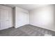 Neutral bedroom features a large closet and plush carpeting at 1027 Gentle Swan St # 689, Henderson, NV 89011