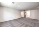 Upstairs bonus room with neutral carpet, overhead lighting, and a laundry room at 1027 Gentle Swan St # 689, Henderson, NV 89011
