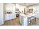 Well-lit kitchen with stainless steel appliances, a center island, and white cabinets with plenty of storage at 1027 Gentle Swan St # 689, Henderson, NV 89011
