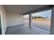 Covered patio featuring a concrete slab floor and wide columns with views of the surrounding desert landscape at 1131 Lupin St, Pahrump, NV 89048