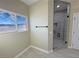Contemporary bathroom design boasts a glass shower, neutral walls, and mountain views at 1131 Lupin St, Pahrump, NV 89048