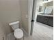 Bathroom includes toilet, stylish vanity with marble countertop, and modern sink fixtures at 1131 Lupin St, Pahrump, NV 89048
