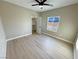 Bedroom with walk-in closet, ceiling fan, and beautiful natural light at 1131 Lupin St, Pahrump, NV 89048