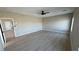 Large bedroom includes sleek wood floors and neutral paint, perfect for customization at 1131 Lupin St, Pahrump, NV 89048