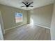 Bedroom with hardwood floors, ceiling fan, and beautiful natural light at 1131 Lupin St, Pahrump, NV 89048